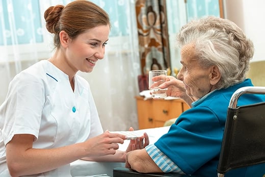 Care provider giving patient medication