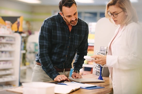 Pharmacist at counter